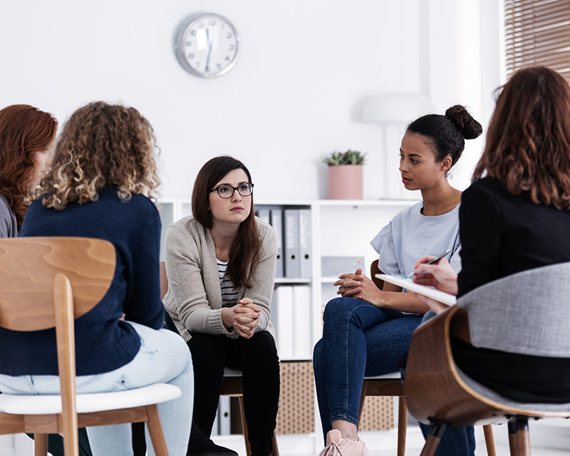 Group of women attending infertility therapy groups